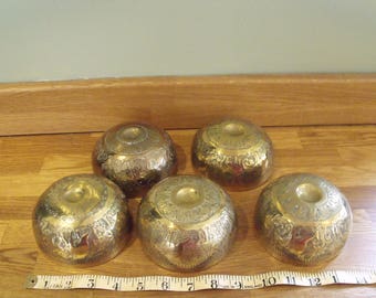 Six Asian decorated repousse brass bowls