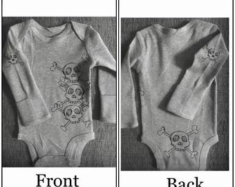 Skull and cross bones onesie