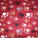 REMNANT-1/2 yard fleece fabric-paw prints