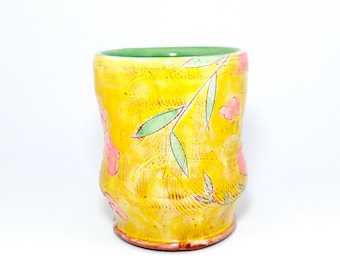 Puffy Floral Earthenware Tumbler. Wheel thrown and altered, food safe cup, made by Kaitlyn Brennan/ Brennan pottery