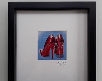 Red stiletto shoes Framed Print