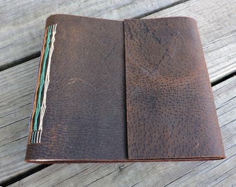 Revista sketchbook de la puntada de mano libro encuadernado cuero aleta con raquetas de nieve