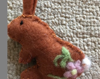 Small felt rabbit with felted flower pattern