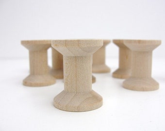 12 Wooden spools 1 1/8" tall