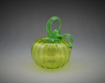 Vibrant Lime Green pumpkin with a brilliant green stem.