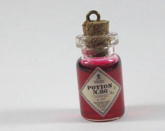 Decorated glass "potion" bottle