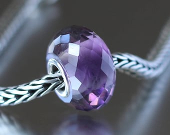 Purple and clear faceted glass bead 2-13