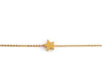 Star Mini gold pendant on fine link bracelet with card