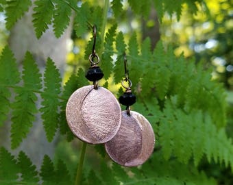 Handmade etched copper earrings.