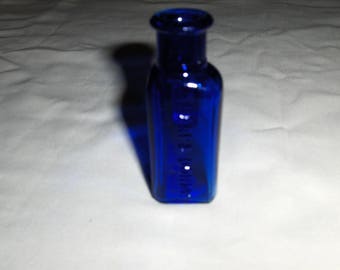 cobolt blue 3-sided Sharp & Dohme medicine bottle