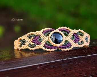 Macrame bracelet with a black glass