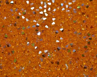 24 - 4mm Genuine Swarovski Crystal Bicone Beads - Sun AB 2X