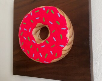 Hot Pink Donut on Walnut Wood