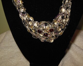 Black and Gold Bib Necklace with Red Medallion