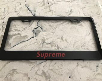 Supreme black metal license frame plate with matching caps red