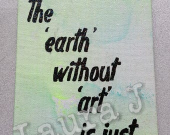 The earth without art quote wall hanging