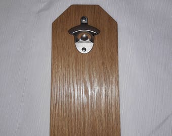 Wall mounted bottle opener with magnetic cap catcher