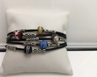 Bracelet leather and glass beads.