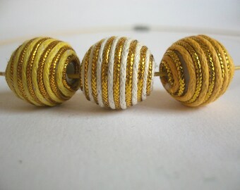 Textile wrapped beads in three different yellow tones and gold Choker necklace three