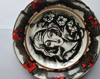 Hand-painted woman on a plate