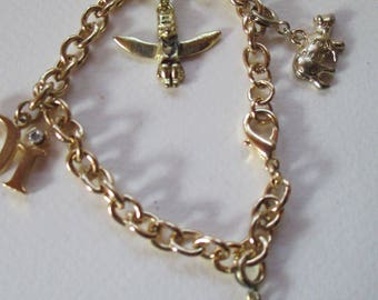 Vintage Charm Bracelet on gold tone chain with lobster clasp closure 4 charms no markings