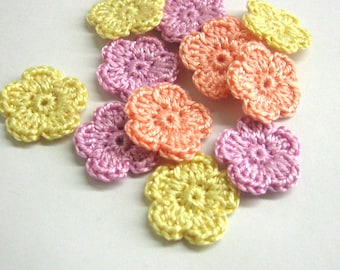 Crocheted tiny flower appliques 0.8 inches set of twelve yellow, peach pink and lavender