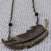 Beautiful extra large feather necklace in a bronze tone