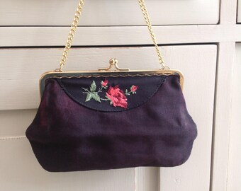 Vintage black fabric evening bag with embroidered rose detail 1960s