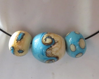 Necklace with 3 ivory and turquoise beads