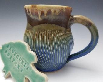 Hand carved textured coffee mug