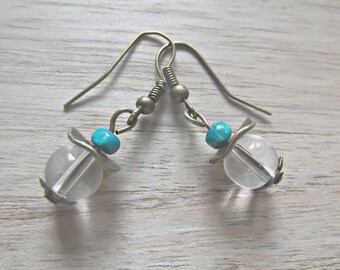Earrings composed of two 8 mm diameter transparent round glass beads