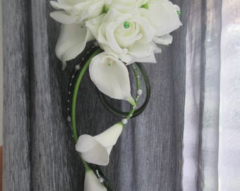Bridal bouquet white and green roses, lilies, waterfall