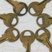 Vintage Master Lock Keys - Seven 1 3/4" brass keys, patina, collect or use as part of a art and crafts project, different blank numbers