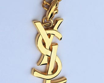 Jewel of bag Yves Saint Laurent - Authentic and Vintage Logo YSL