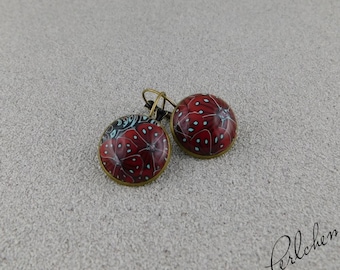 Earrings with a cabochon made of polymer clay