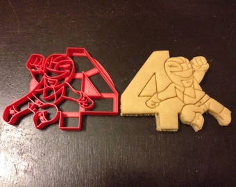 Power Rangers Cookie Cutter next to the number 4. Perfect for your kid's 4th year birthday party. Celebrate their fourth with the rangers!