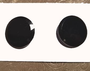 Two vintage jet black glass buttons