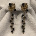 Black Crystal with Gold-tone Starburst Caps and Spacers 4&1/4" Drop Clip Earrings - CA 1950's - Item VC151