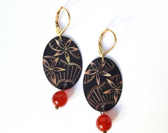 Oval earrings etched brass with a floral reminiscent of lace.