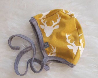 Mustard elk pilot hat by Little Lapsi. Baby hat with ties.