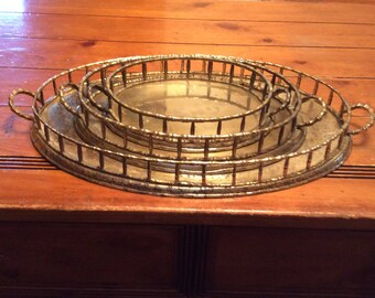 A vintage set of 3 solid brass decorative trays