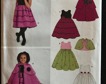 New Look 6527 - Girl's Dress, Tiered Cape, and Capelet - Size 3 4 5 6 7 8