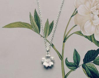 Delicate sterling silver flower pendant