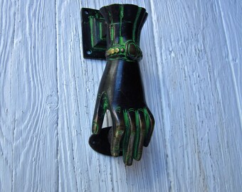 Solid brass hand door knocker