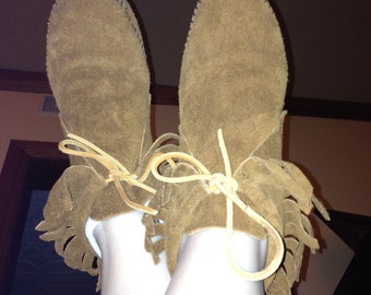 Fringed brown suede moccasins