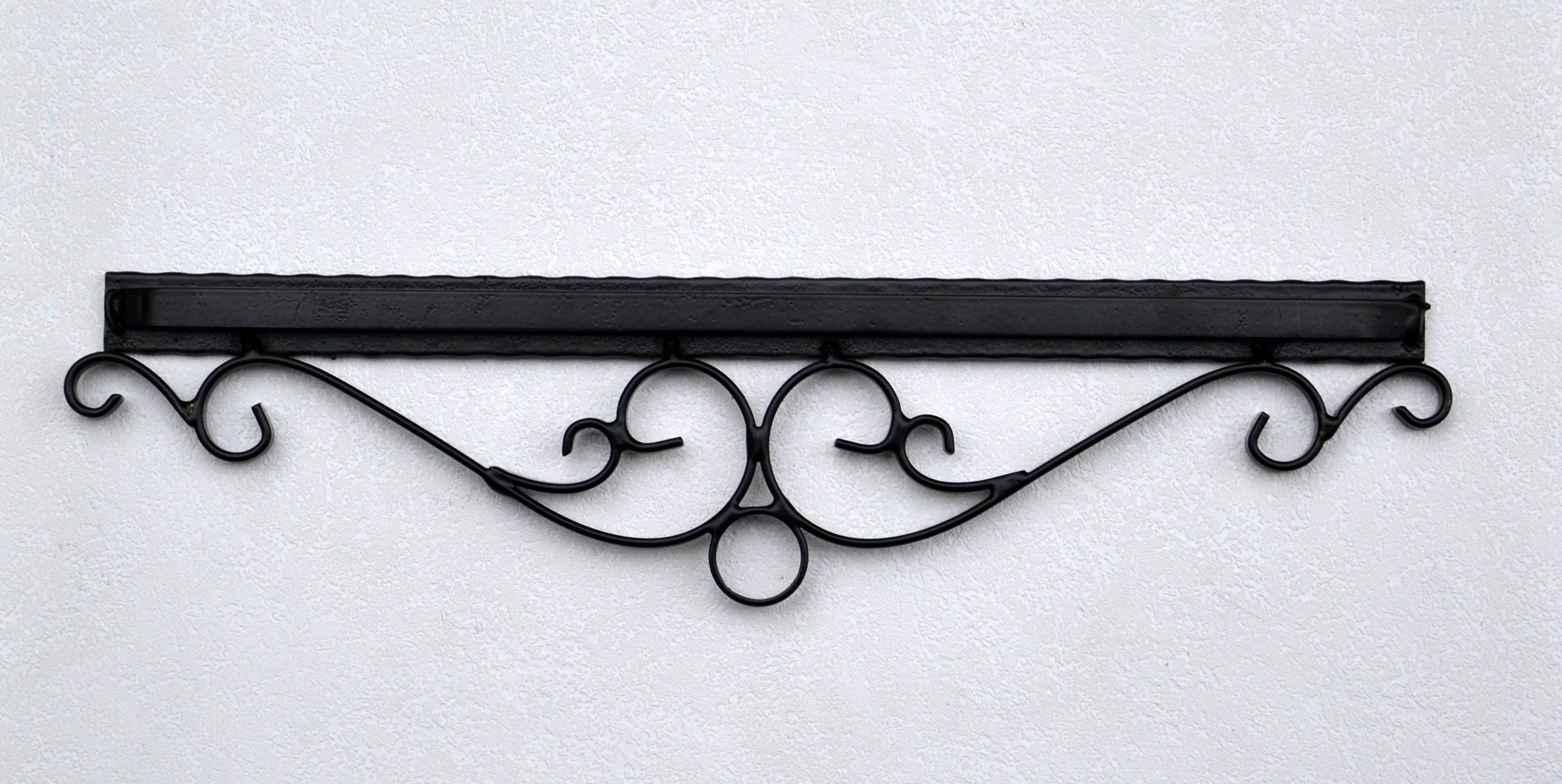 Vintage wall rug hanger Wrought iron quilt rack Tapestry and embroidery