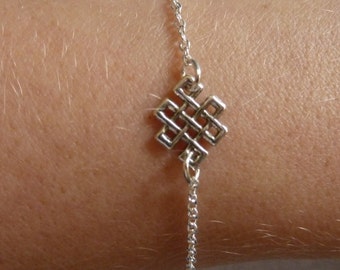 Silver bracelet with the infinite Knot as an intermediate piece