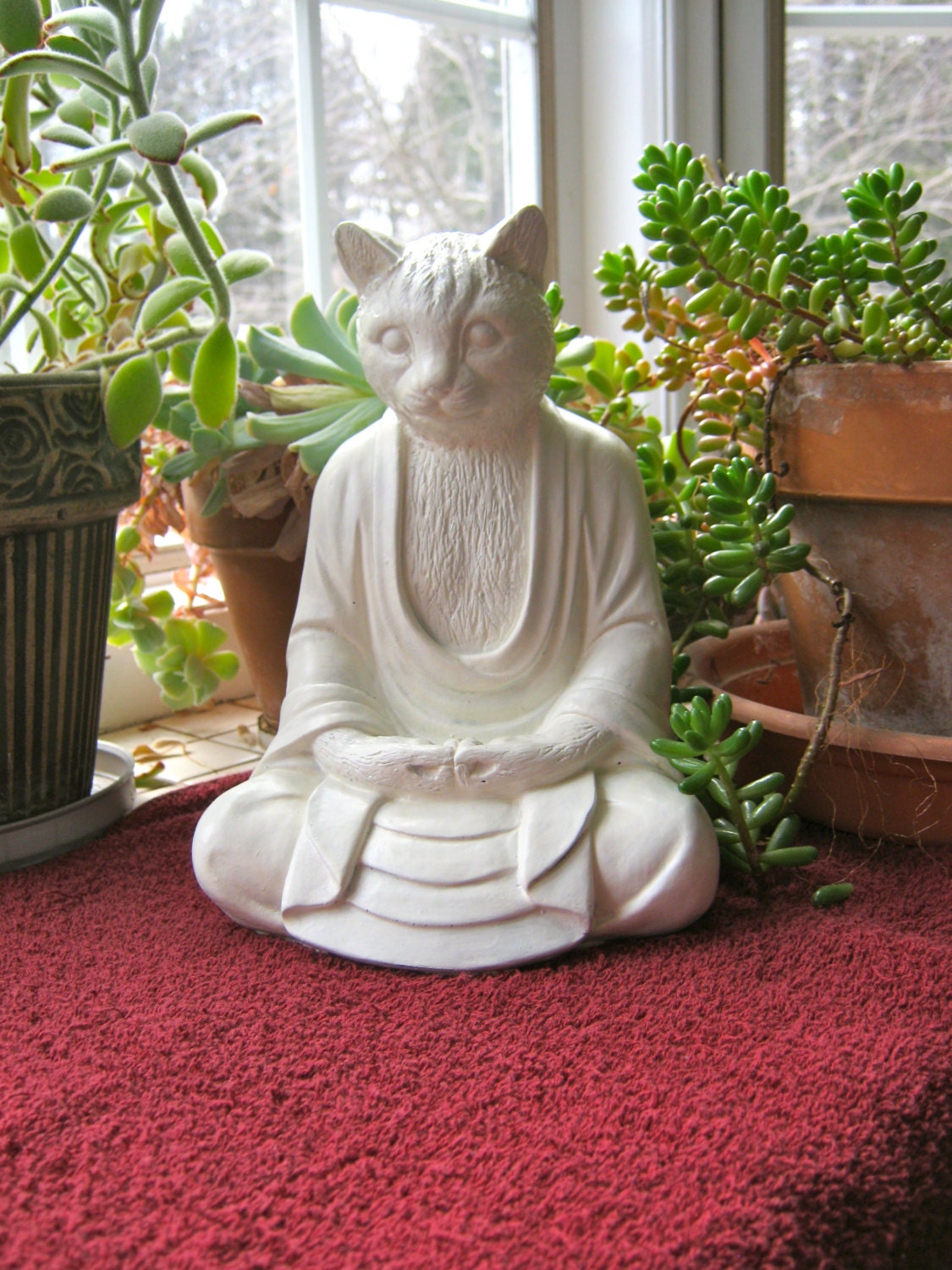 meditating cat sculpture