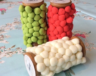 Gorgeous pom pom trimmings in 3 colours. Sold Per Roll