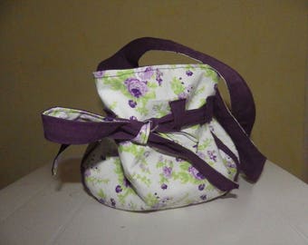 featuring a reversible purse handbag